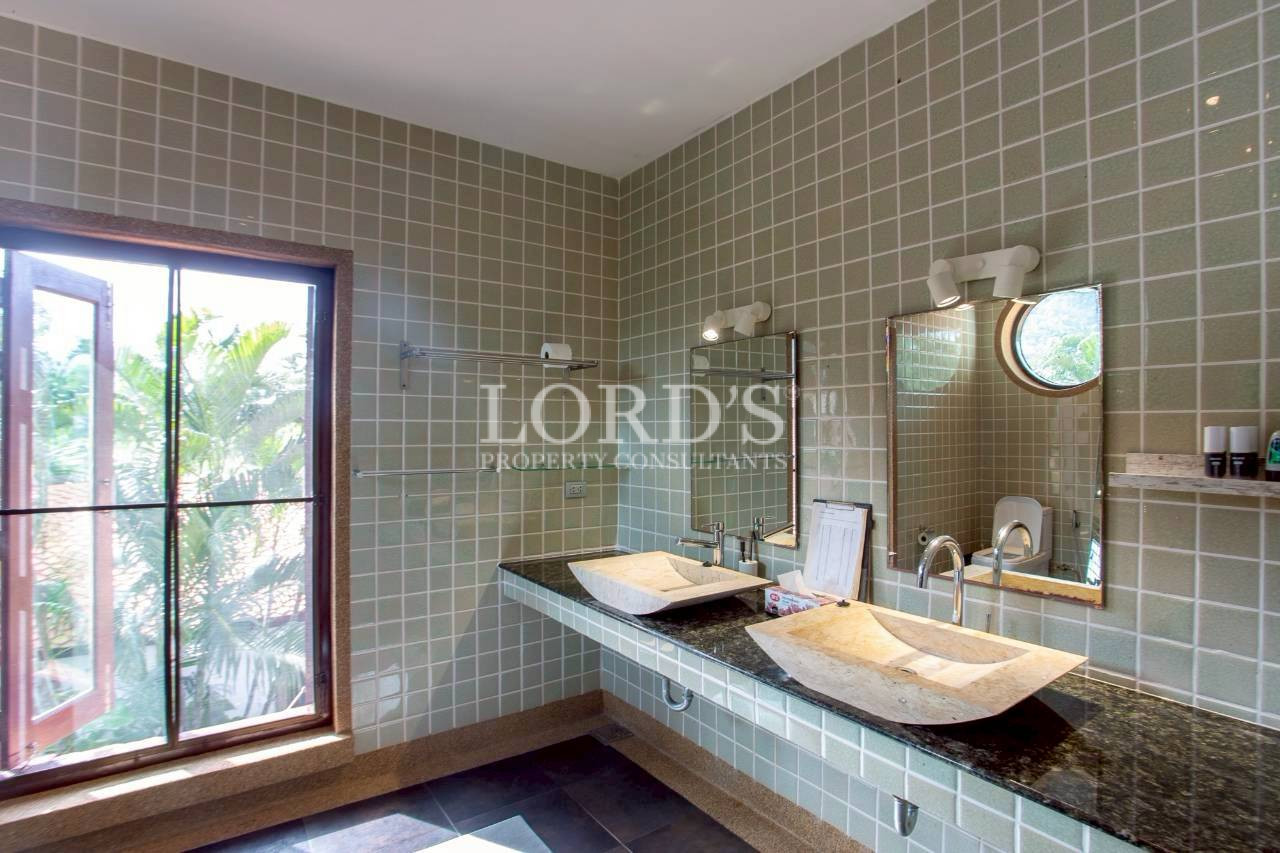 Modern bathroom with tiled walls and natural light
