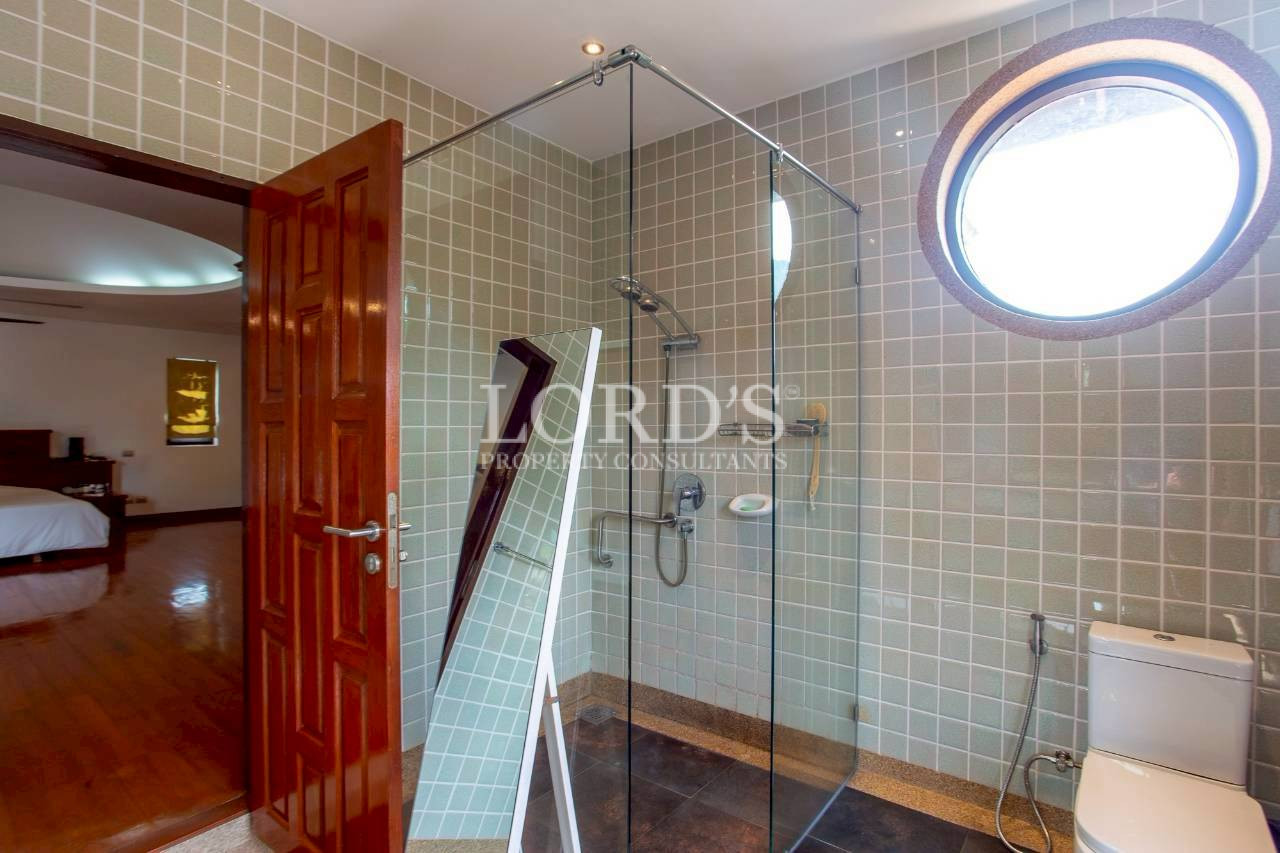 Luxury bathroom with glass shower enclosure and modern fixtures