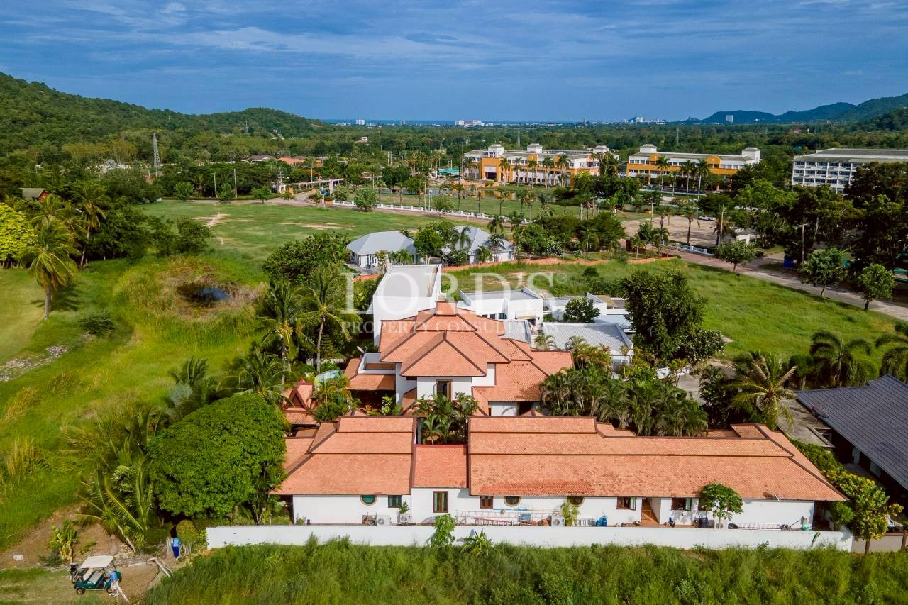 Panoramic countryside and residential community with mountain backdrop