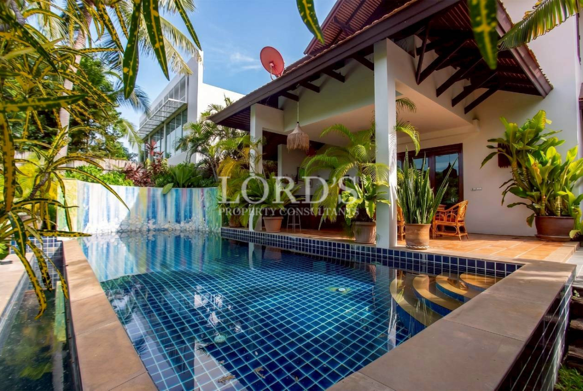 Luxury villa with swimming pool and tropical outdoor living space