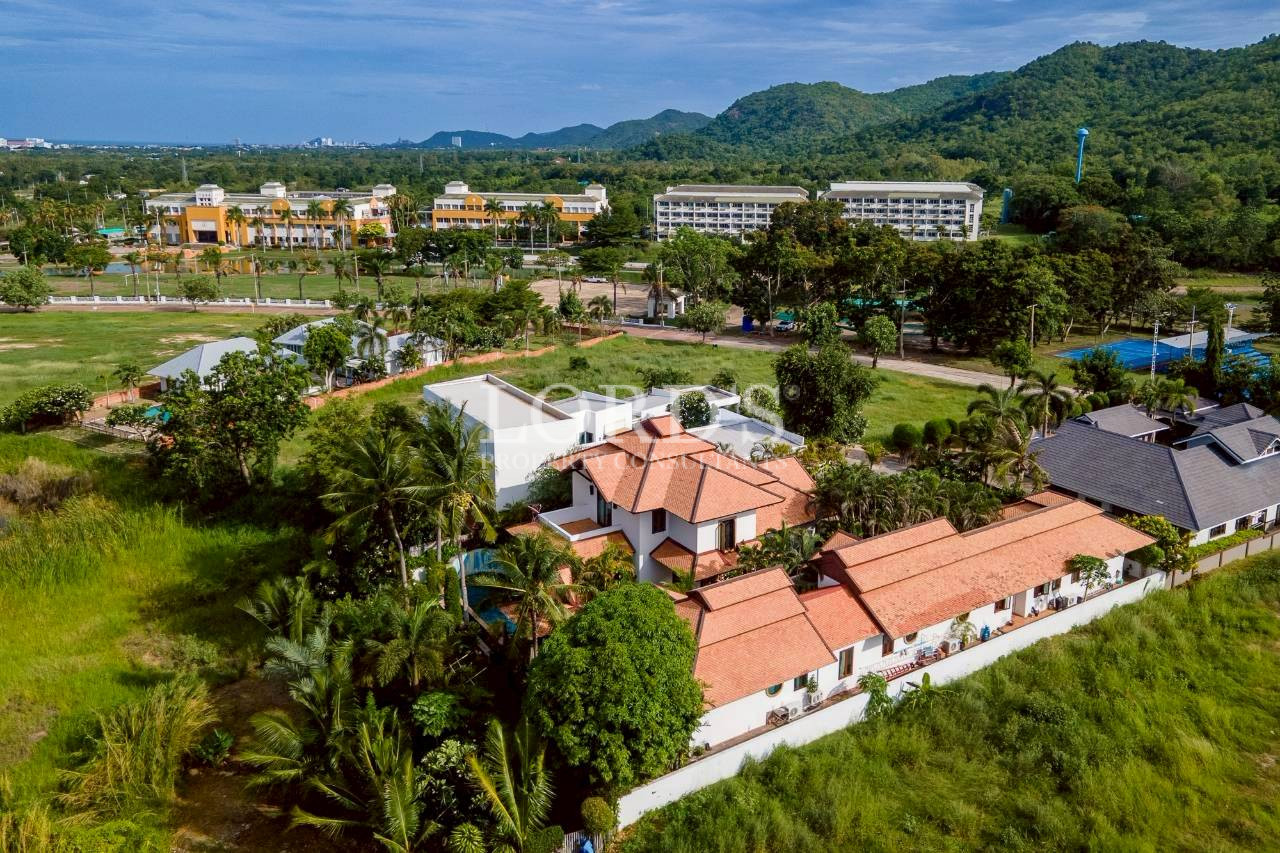 Aerial view of luxury resort and surrounding tropical landscape
