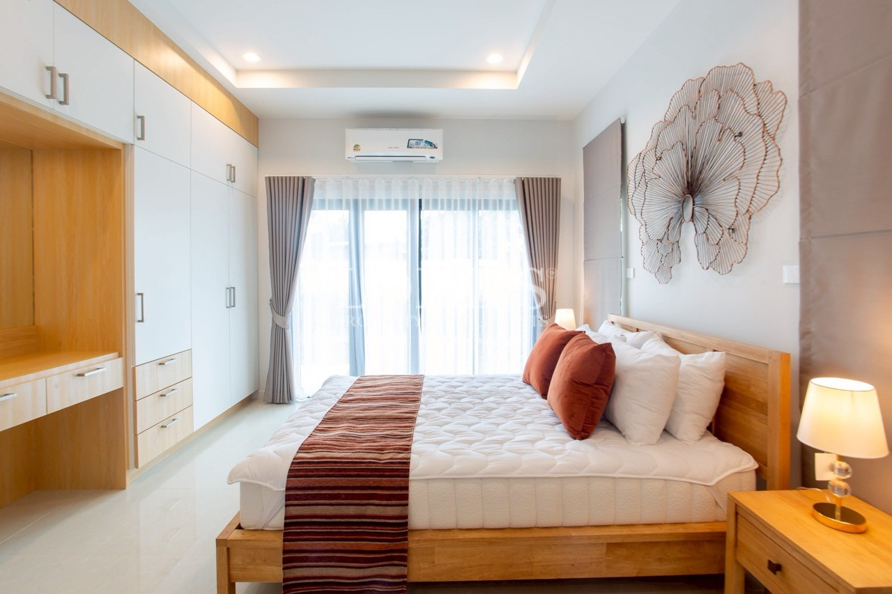 Contemporary bedroom with large window