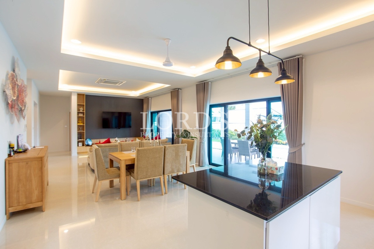 Open-plan kitchen with breakfast bar