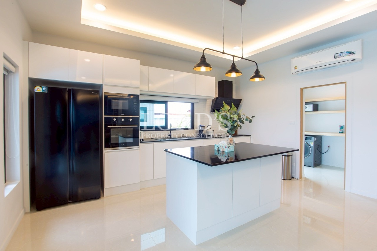 Modern kitchen with island and pendant lighting