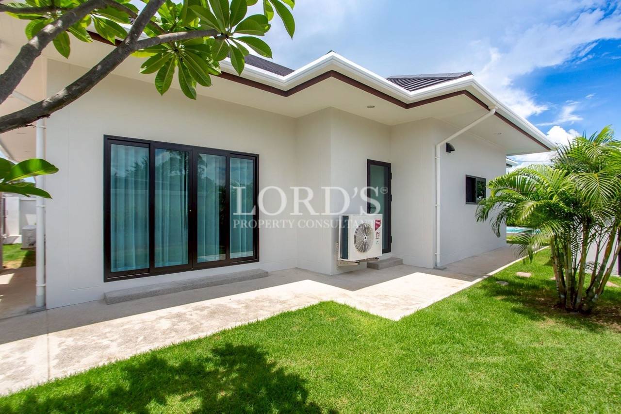 Modern villa exterior with landscaped garden