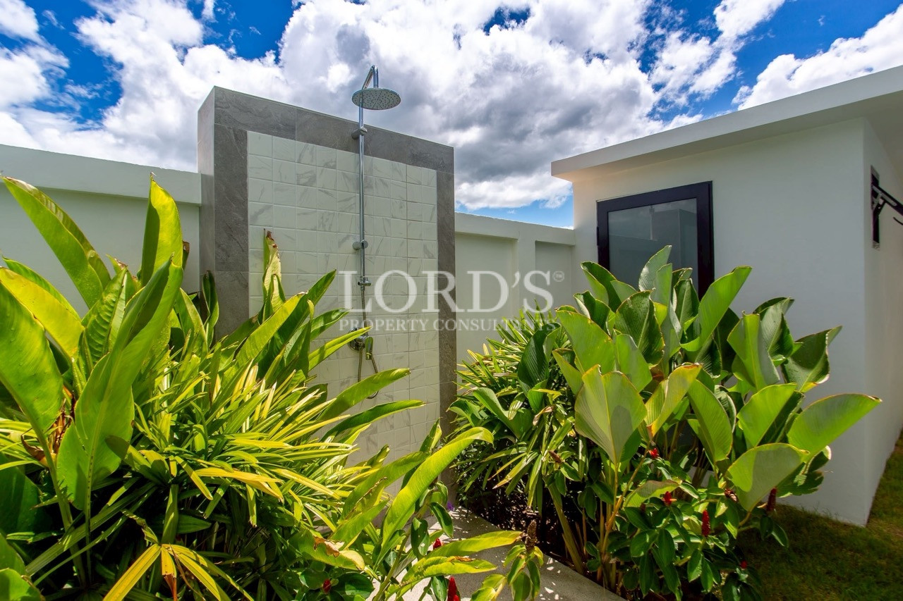 Garden pathway beside modern villa