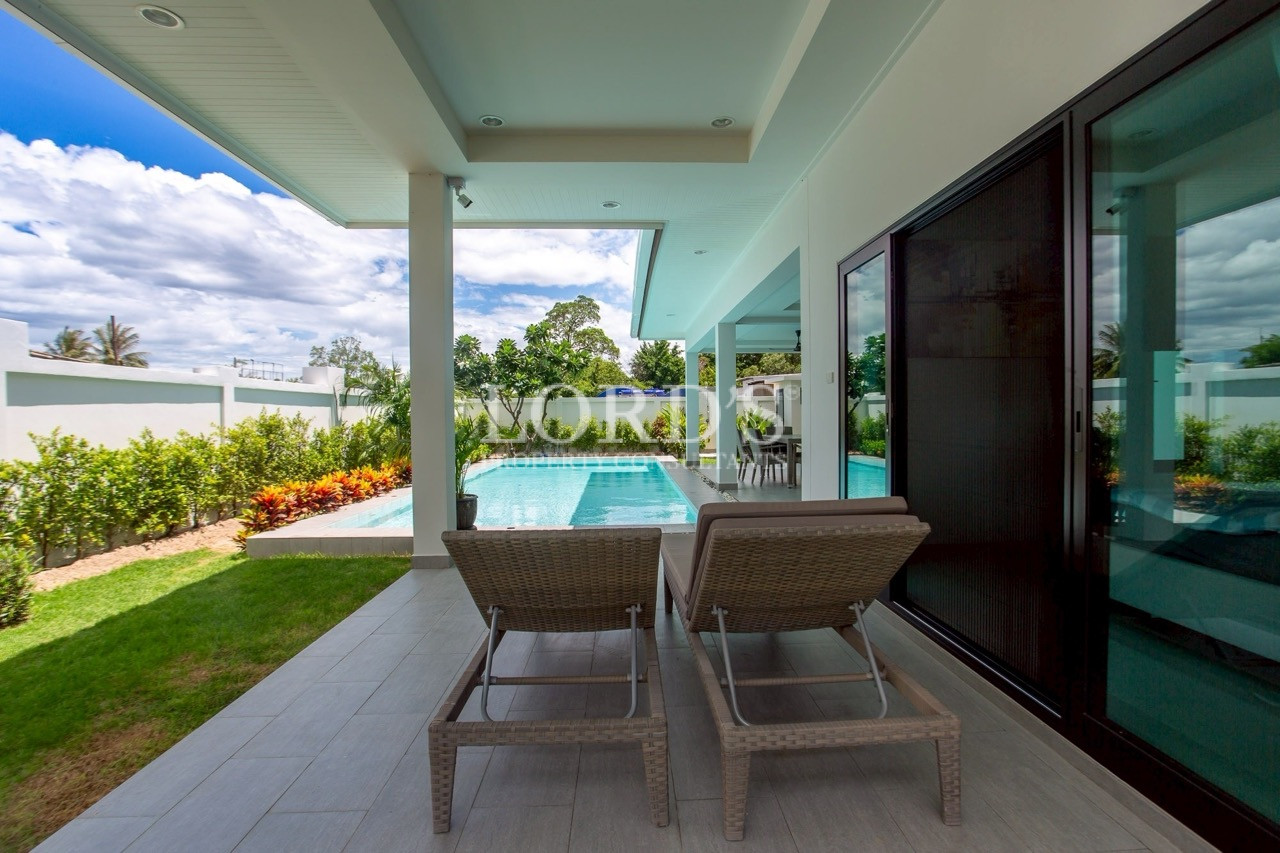 Covered patio overlooking the swimming pool