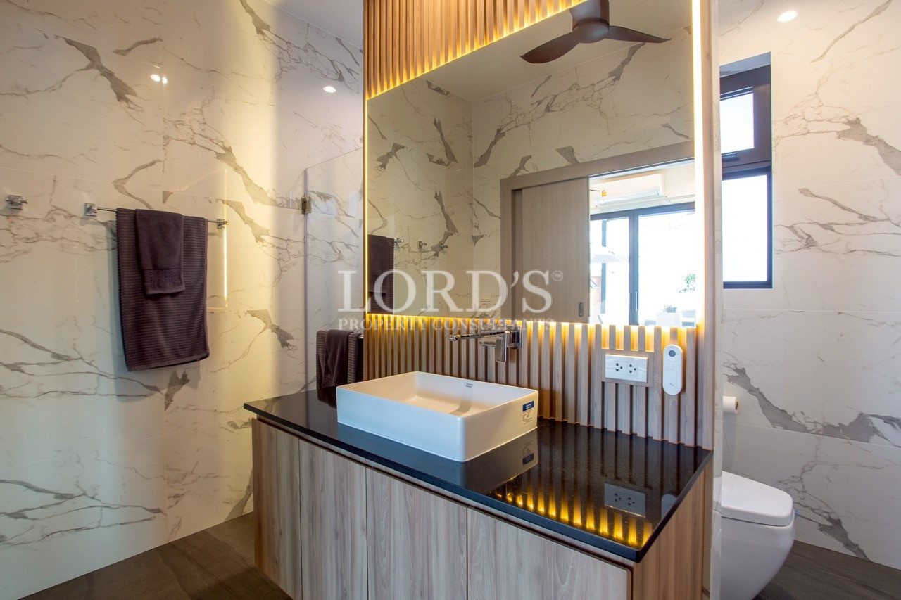 Bathroom with marble walls and vanity