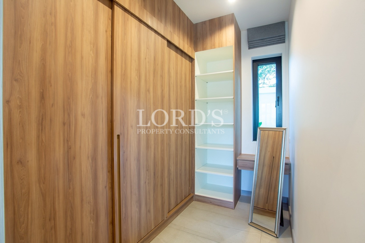 Bedroom with timber feature wall
