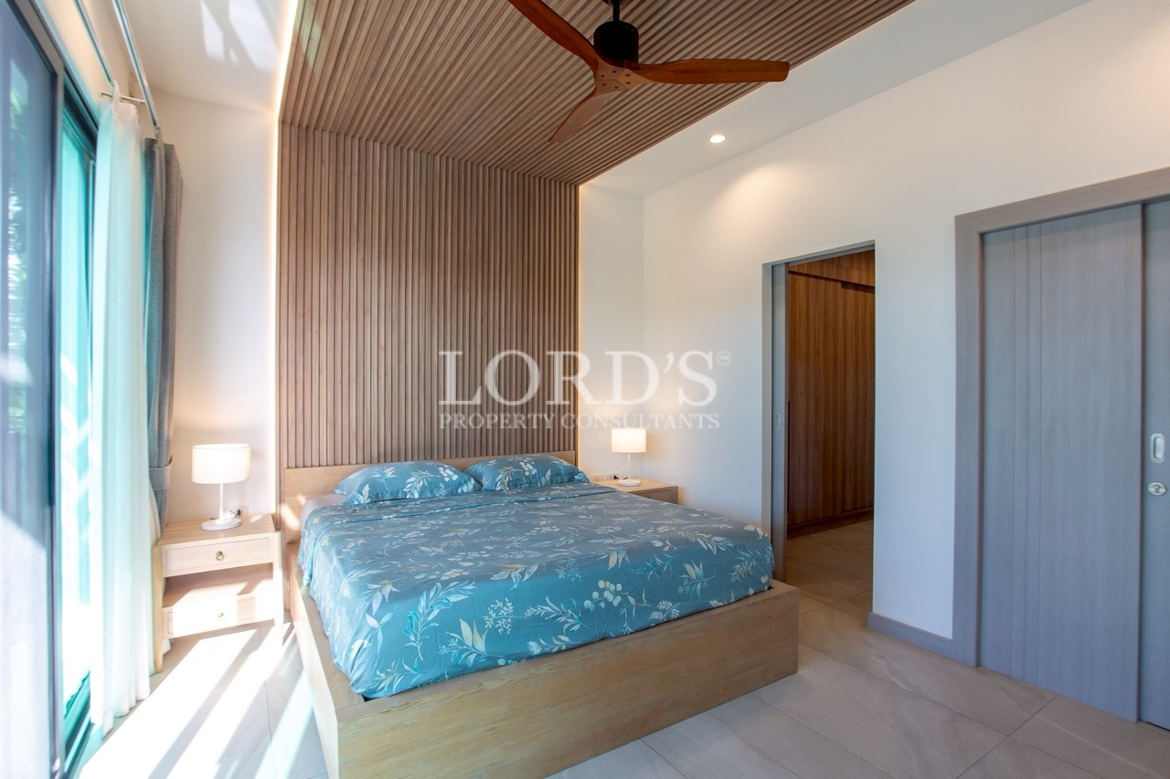 Bedroom with timber ceiling and ceiling fan