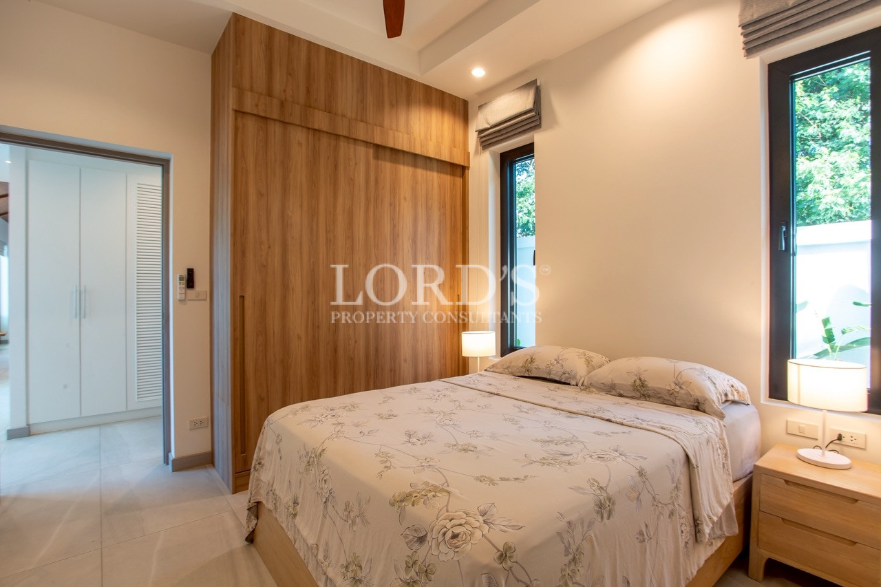 Bedroom with timber feature wall