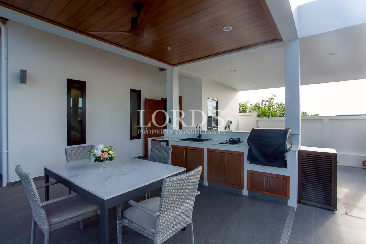Covered outdoor lounge with timber ceiling
