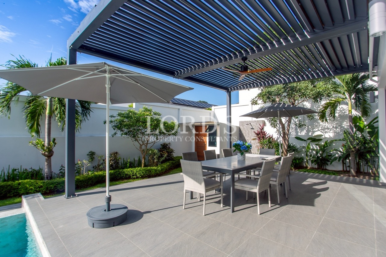Covered pergola beside the swimming pool