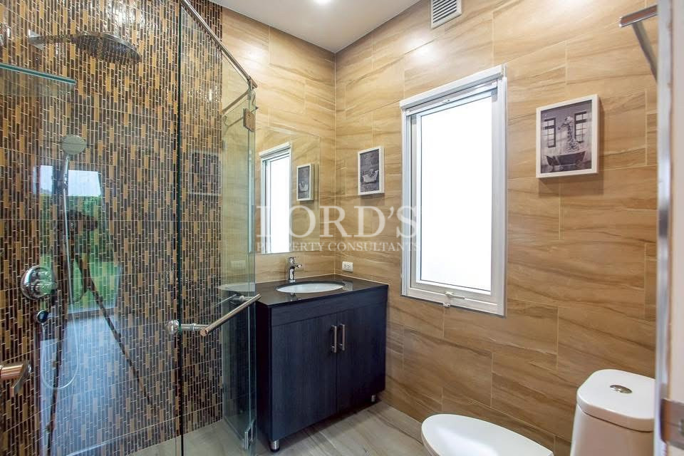 Bathroom with wood accent walls