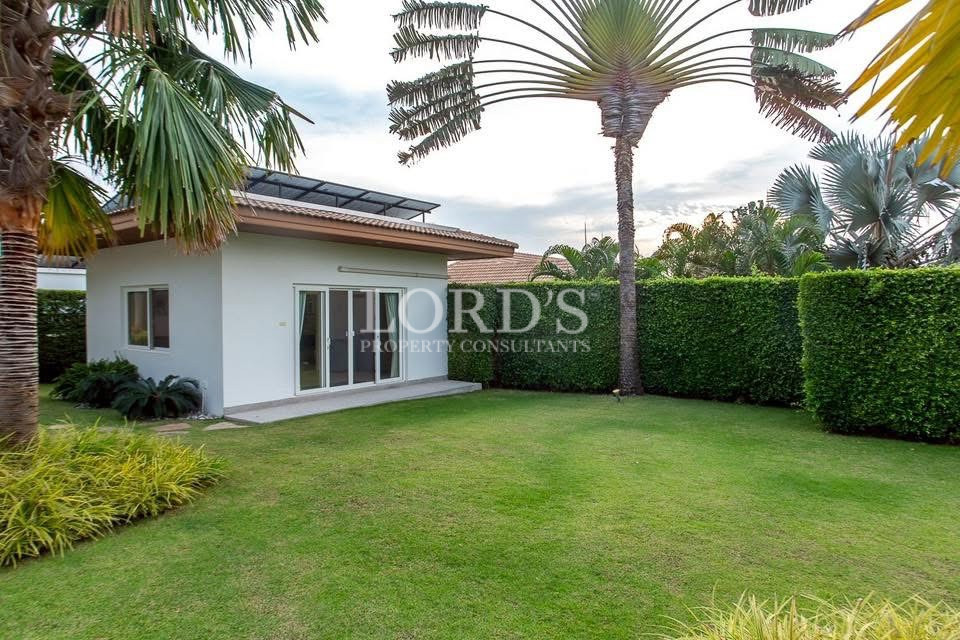 Tropical villa with landscaped lawn
