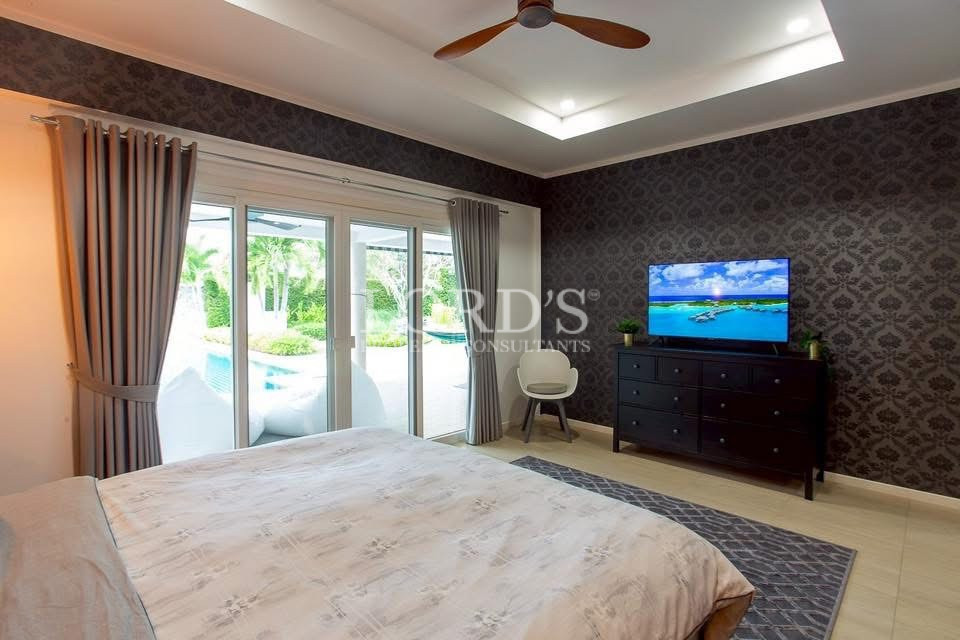 Bedroom with garden views and TV