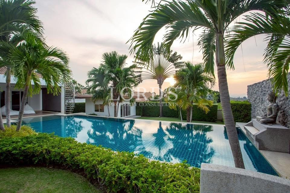 Swimming pool surrounded by palm trees