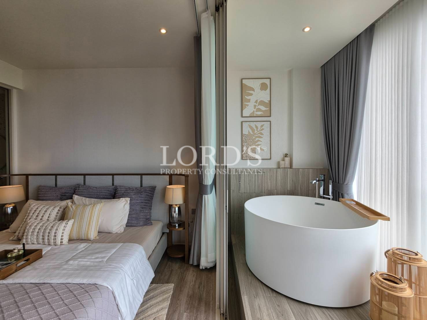 Luxury bedroom with freestanding bathtub, floor-to-ceiling curtains, and modern contemporary interior