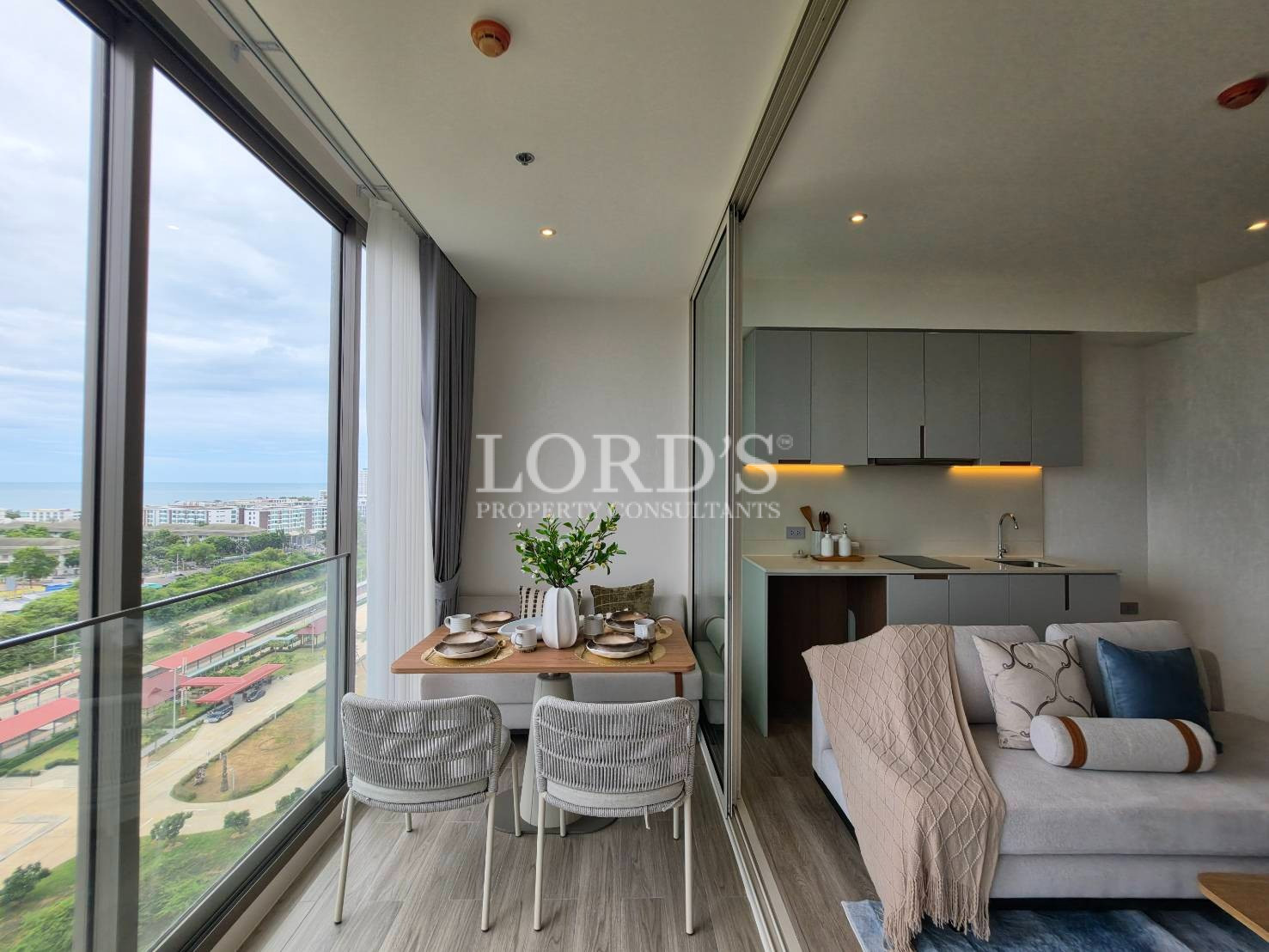 Open-concept kitchen with modern cabinetry and large windows