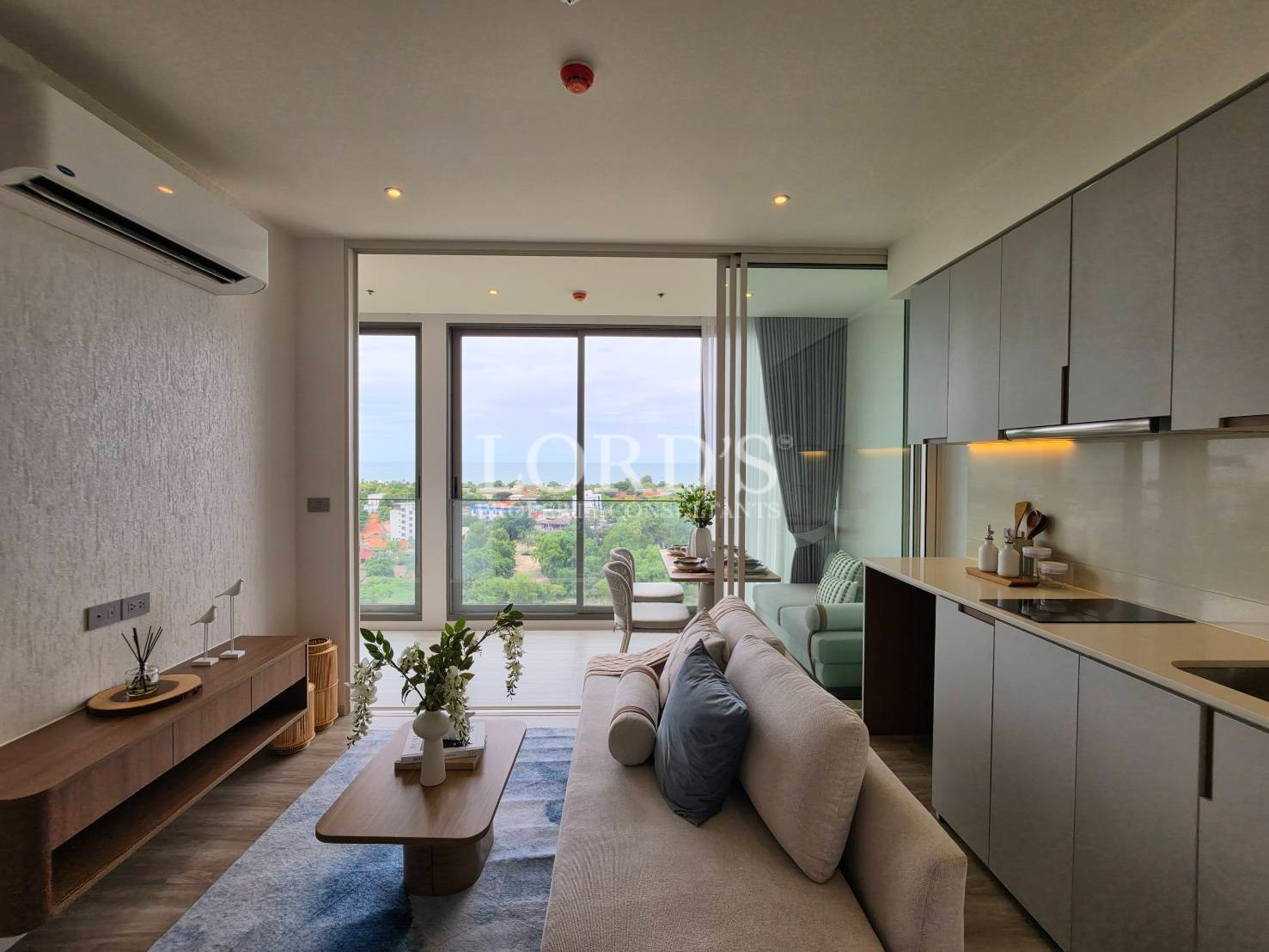 Modern living and dining area with panoramic balcony view