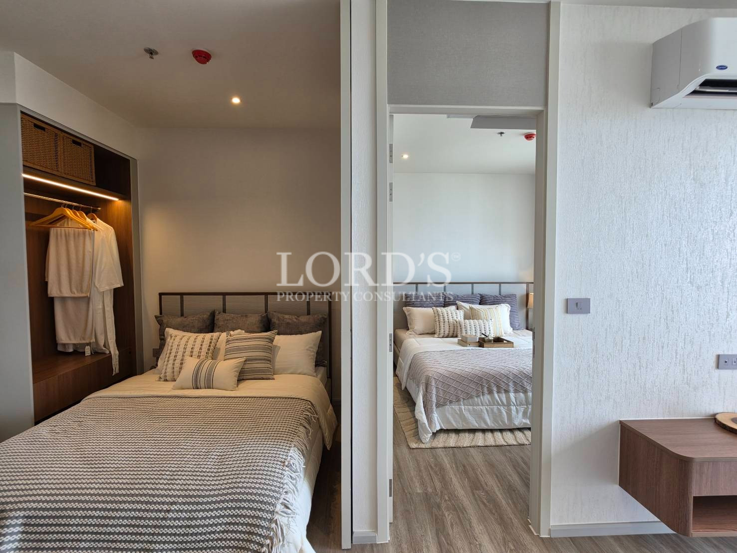Luxury bedroom entrance with built-in wardrobe and modern lighting