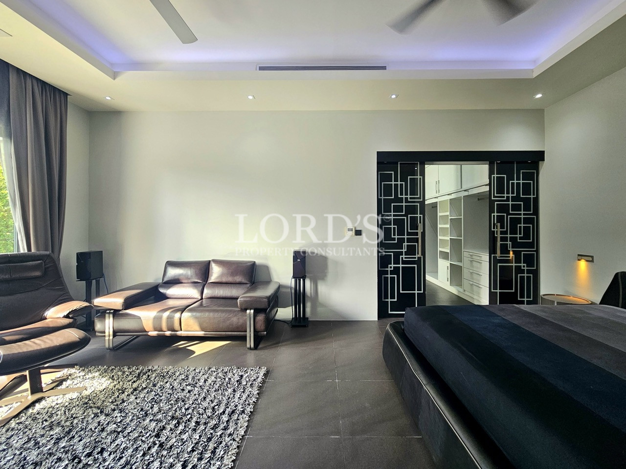Luxury master suite with lounge area and walk-in wardrobe