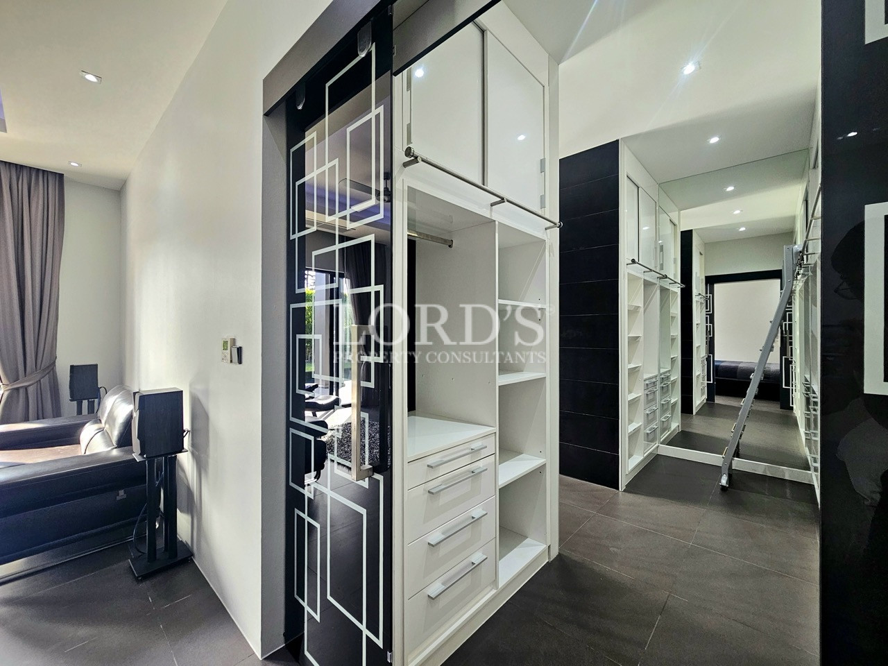 Luxury walk-in wardrobe with custom storage and mirrored closets