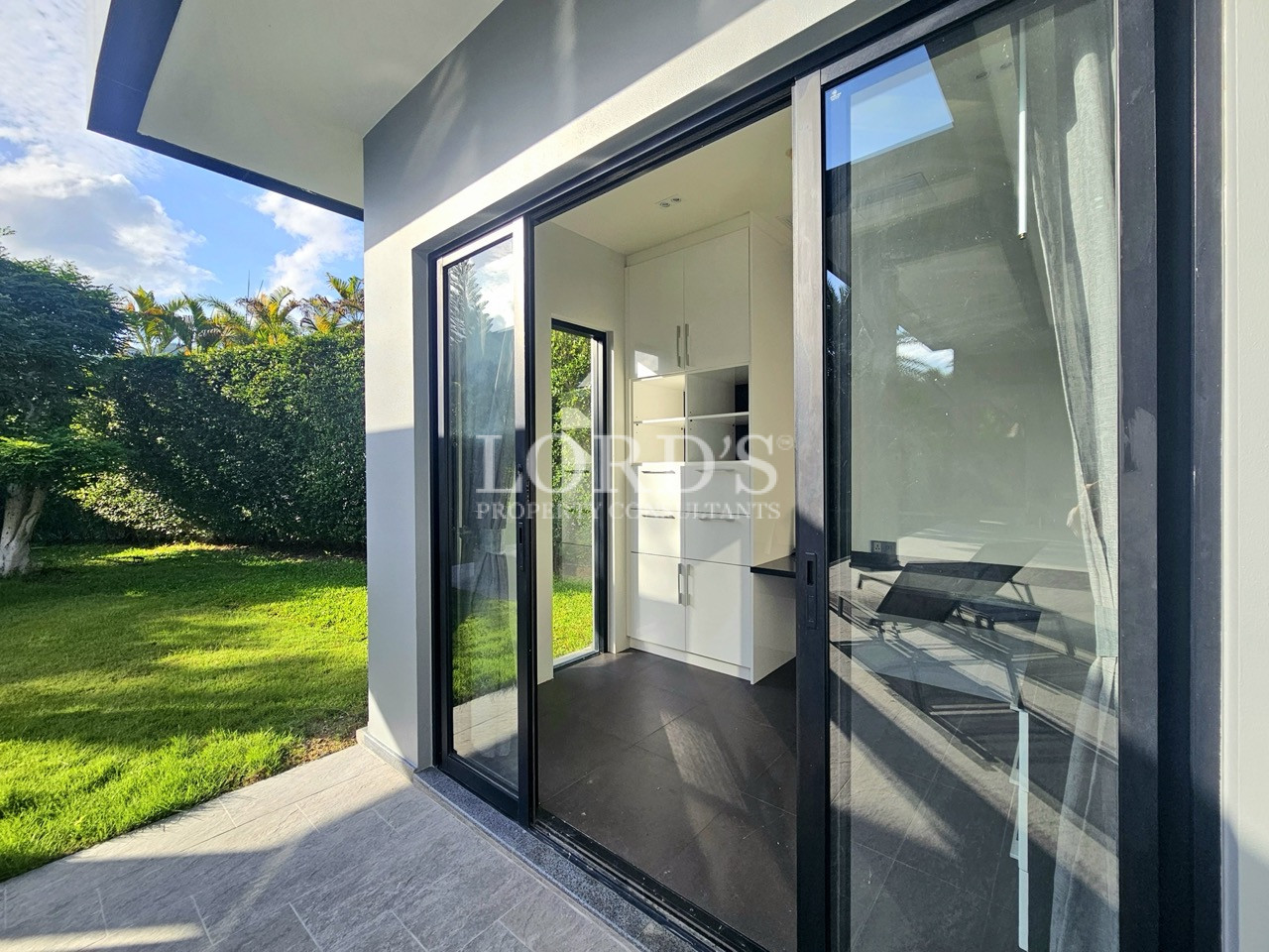 Home office with sliding glass doors and garden access