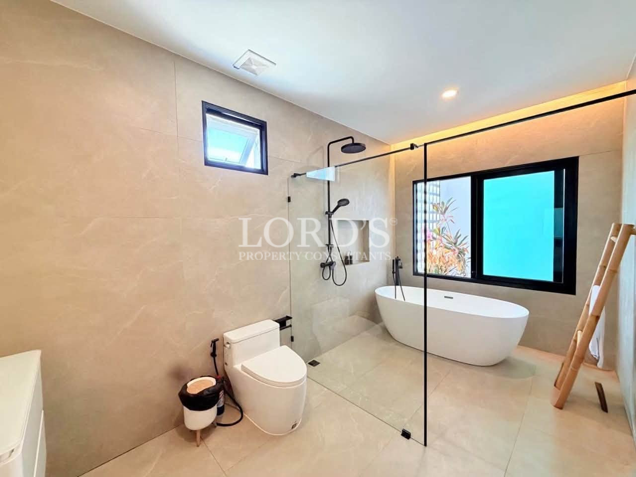 Modern luxury bathroom with a freestanding bathtub and glass-enclosed shower