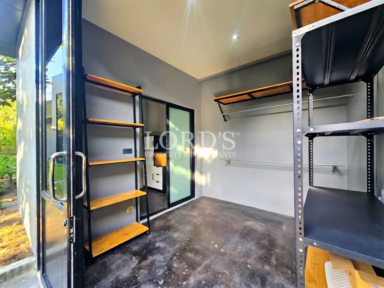 Modern walk-in wardrobe with open shelving