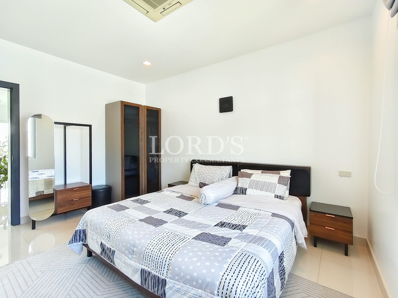 Contemporary bedroom with built-in wardrobe
