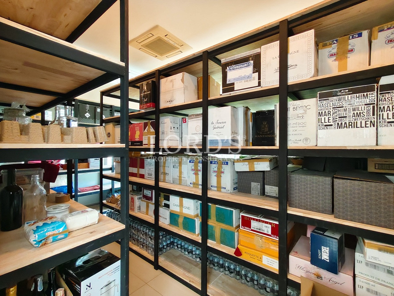 Luxury walk-in pantry with custom shelving, organized storage, and premium storage solutions