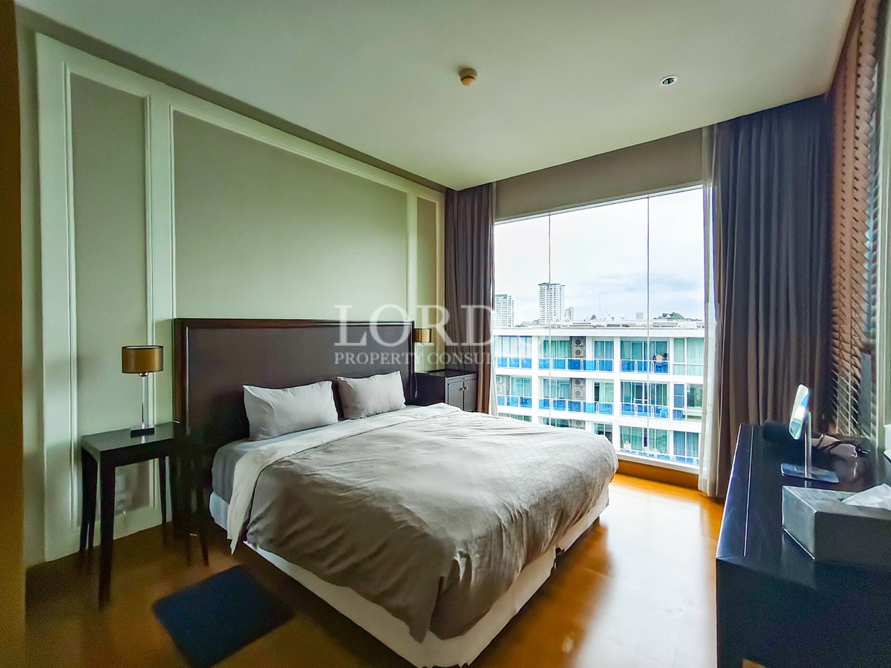 Modern bedroom with king-size bed and large window