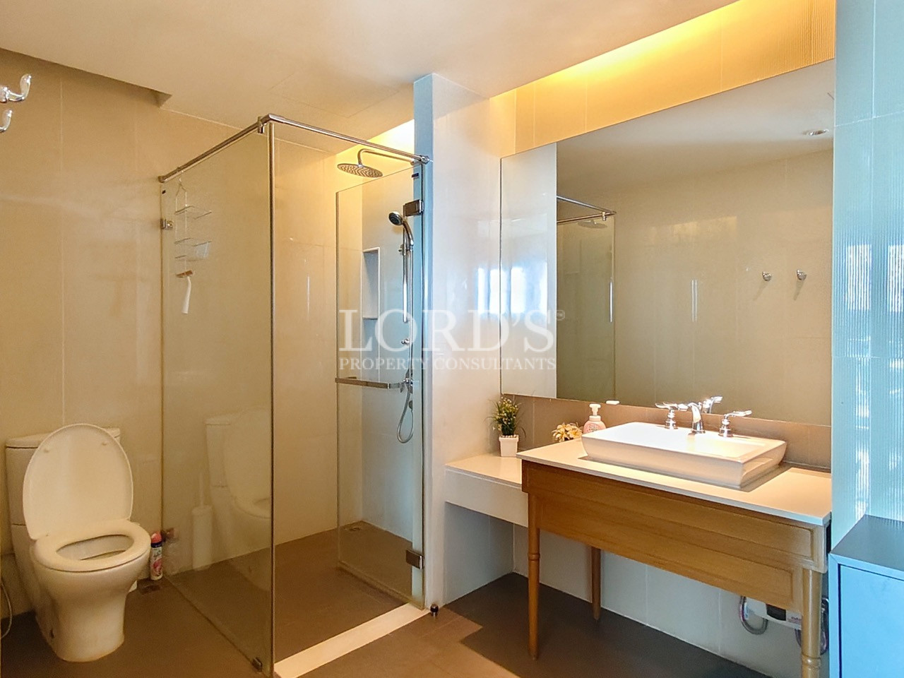 Modern bathroom with glass shower enclosure and vanity