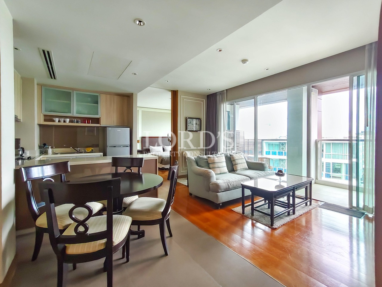 Modern open-plan living room, dining area, and kitchen