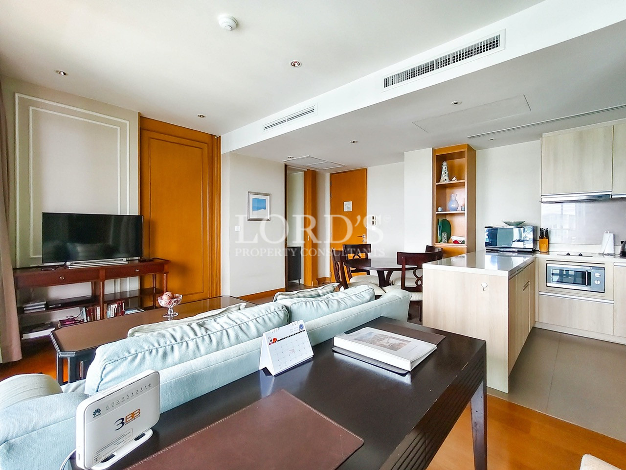 Modern open-plan living room with kitchen and dining area