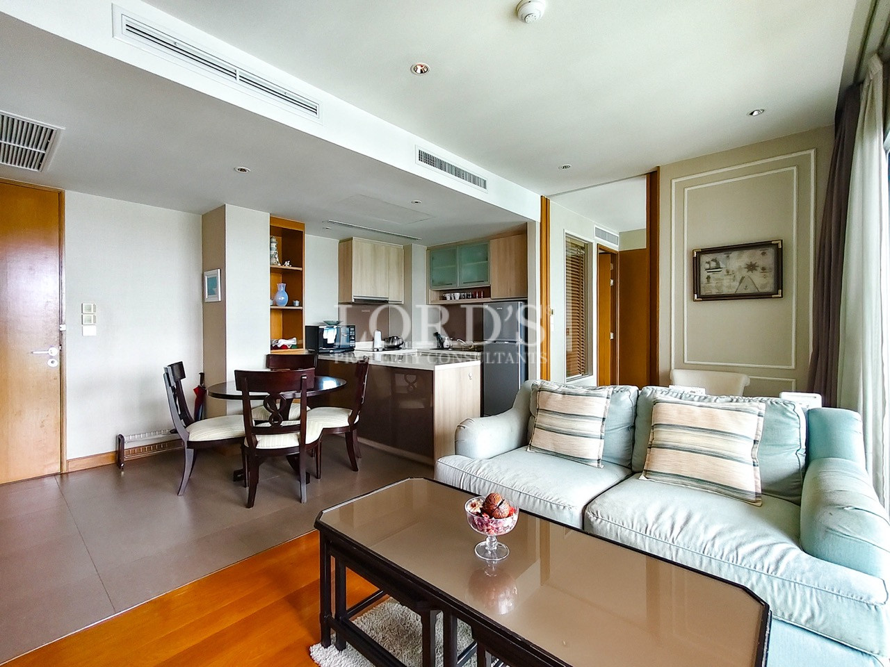 Modern living room with open-plan kitchen and dining area