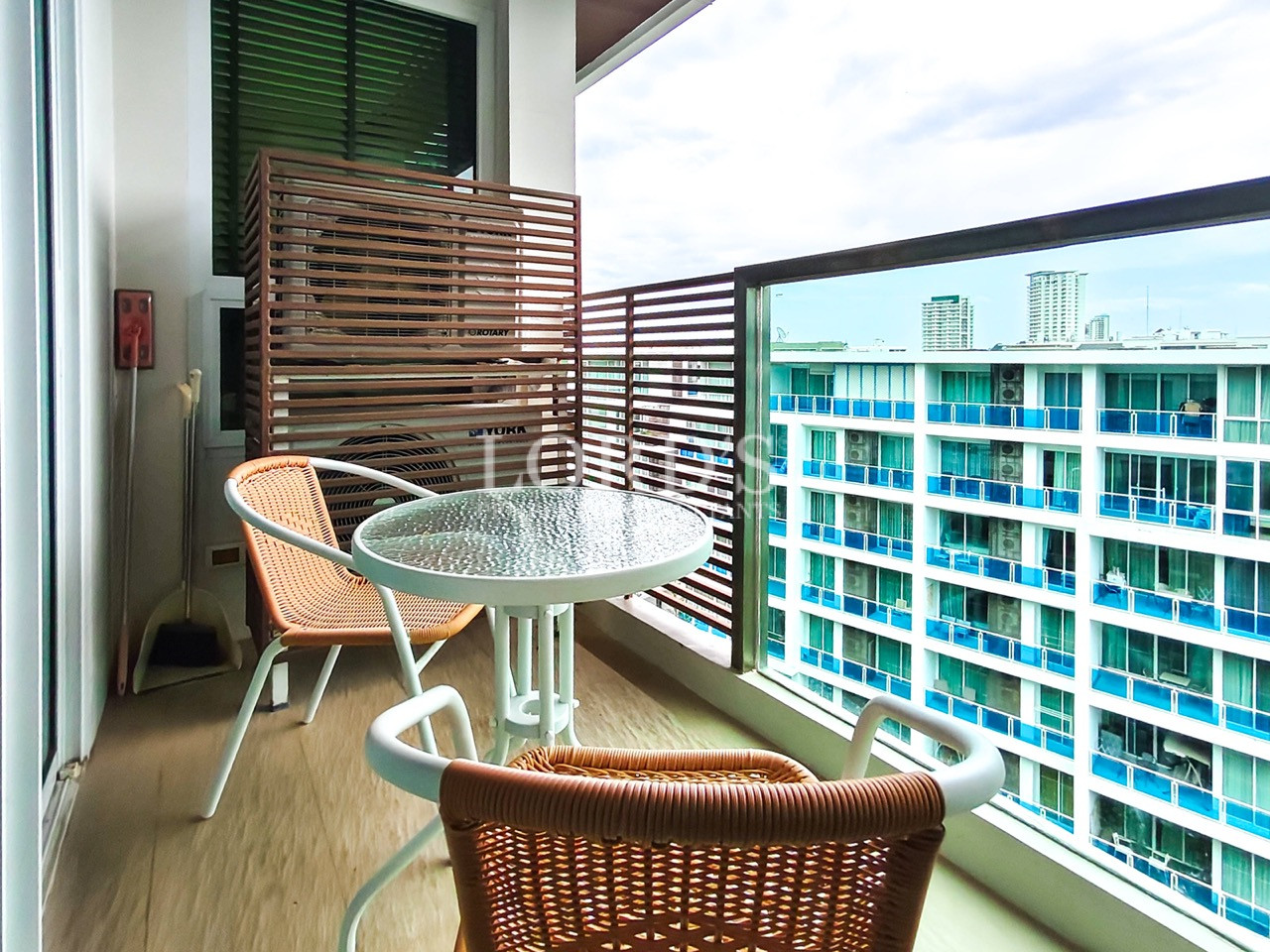 Private balcony with outdoor seating and city view