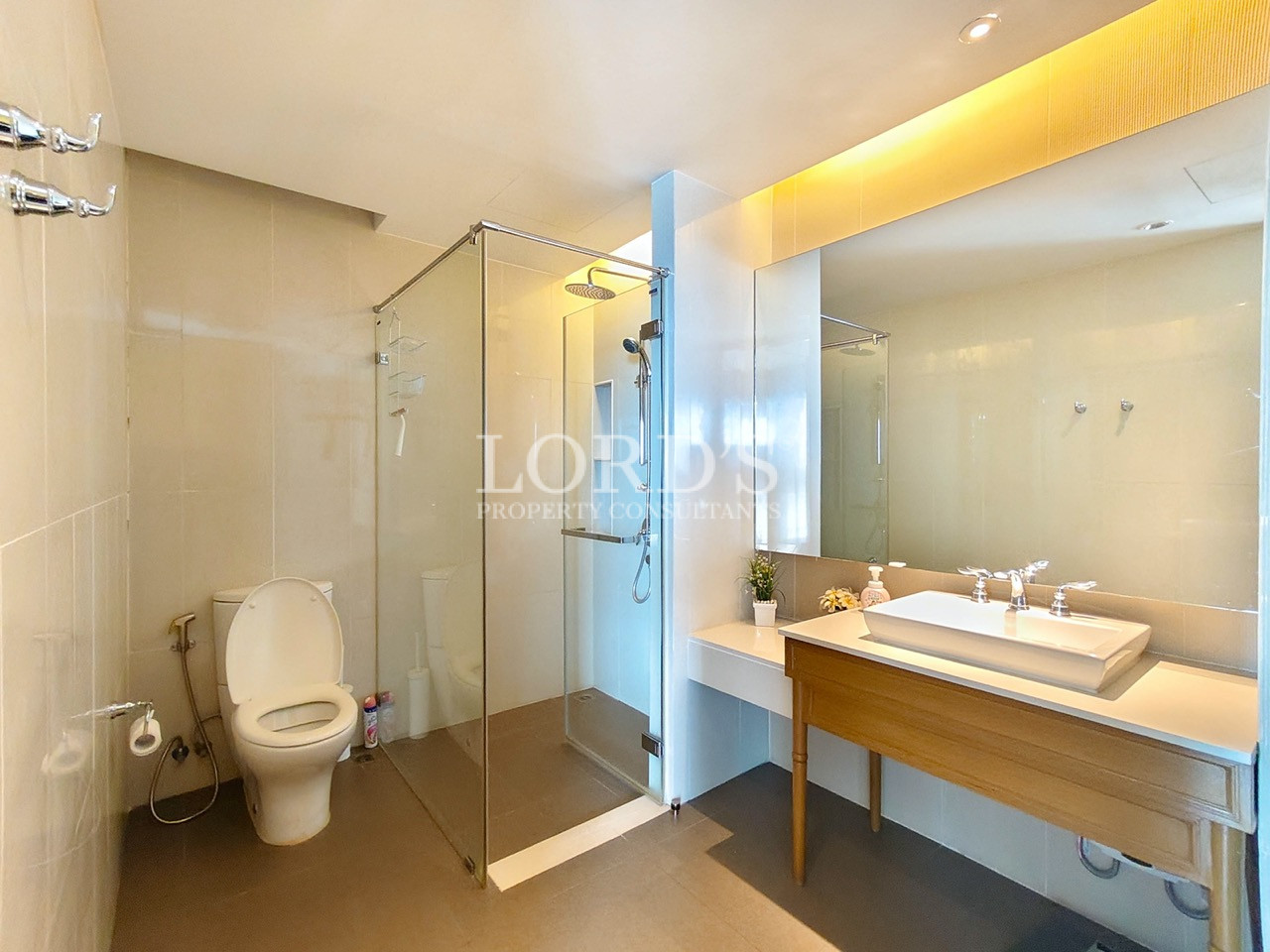Modern luxury bathroom with glass shower and vanity
