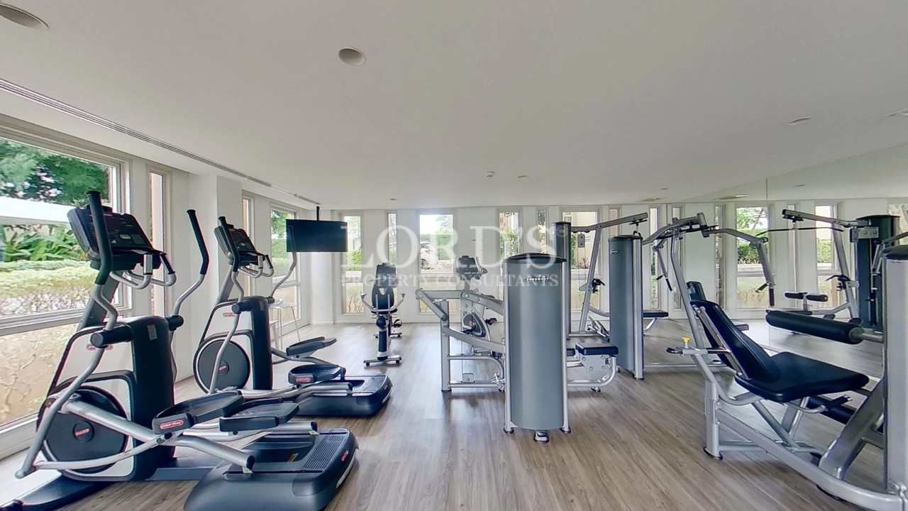 Modern Apartment Fitness Center with Cardio and Strength Training Equipment